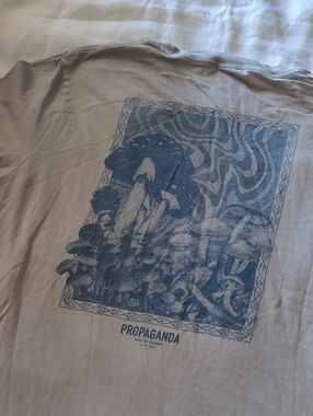 Ghanda Beige Vintage Logo Tee — Black Tag Detail